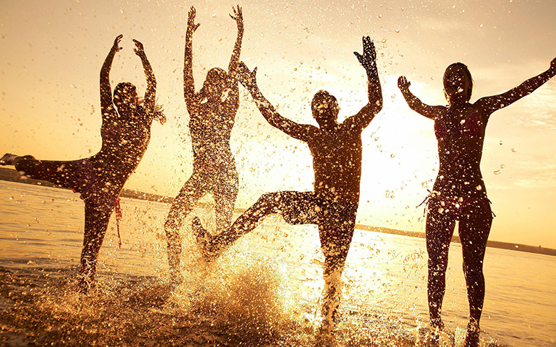Happy People dancing in the water
