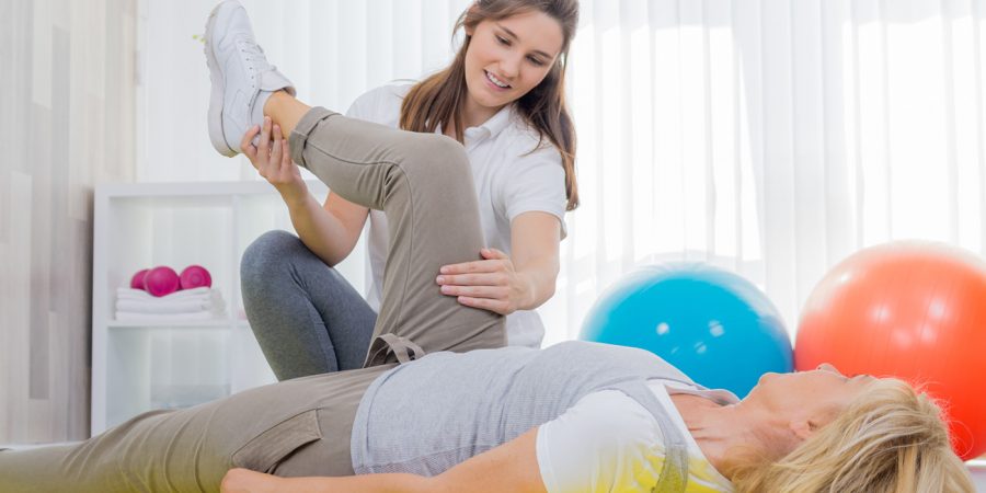 Physical Therapy Aide working with a patient